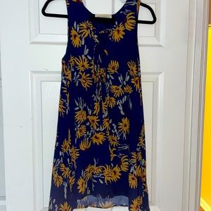 A shaped tie dress. Navy with sunflowers.